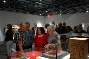 Museum donors looking at one of its exhibits
