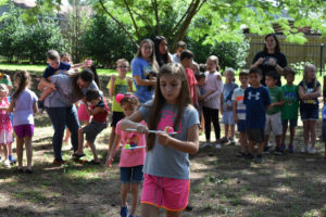 Dino Campers participating in an egg race
