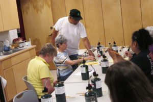 Presley Byington leading a flute-making workshop (2014)