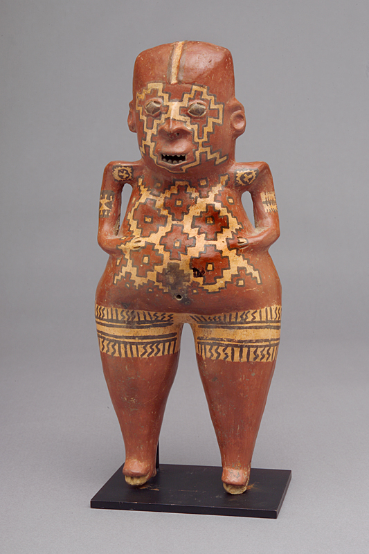 A painted effigy of a man with a large waist and small hands from Chupícuaro