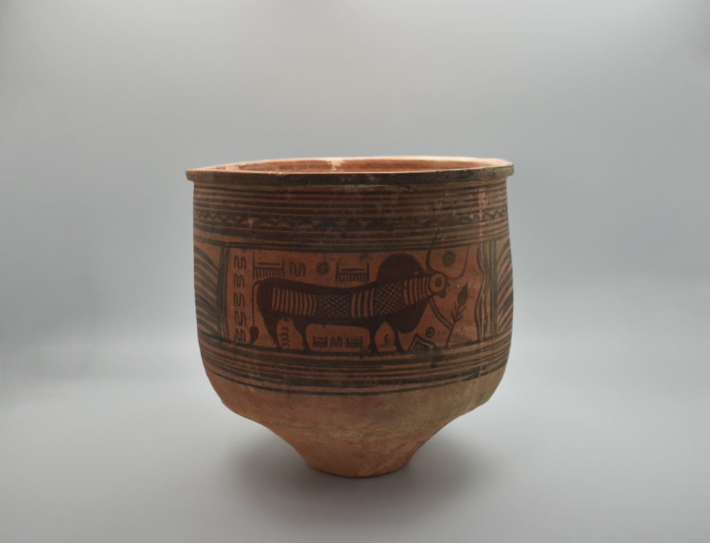 A painted jar from the Indus Valley Culture covered in glyphs