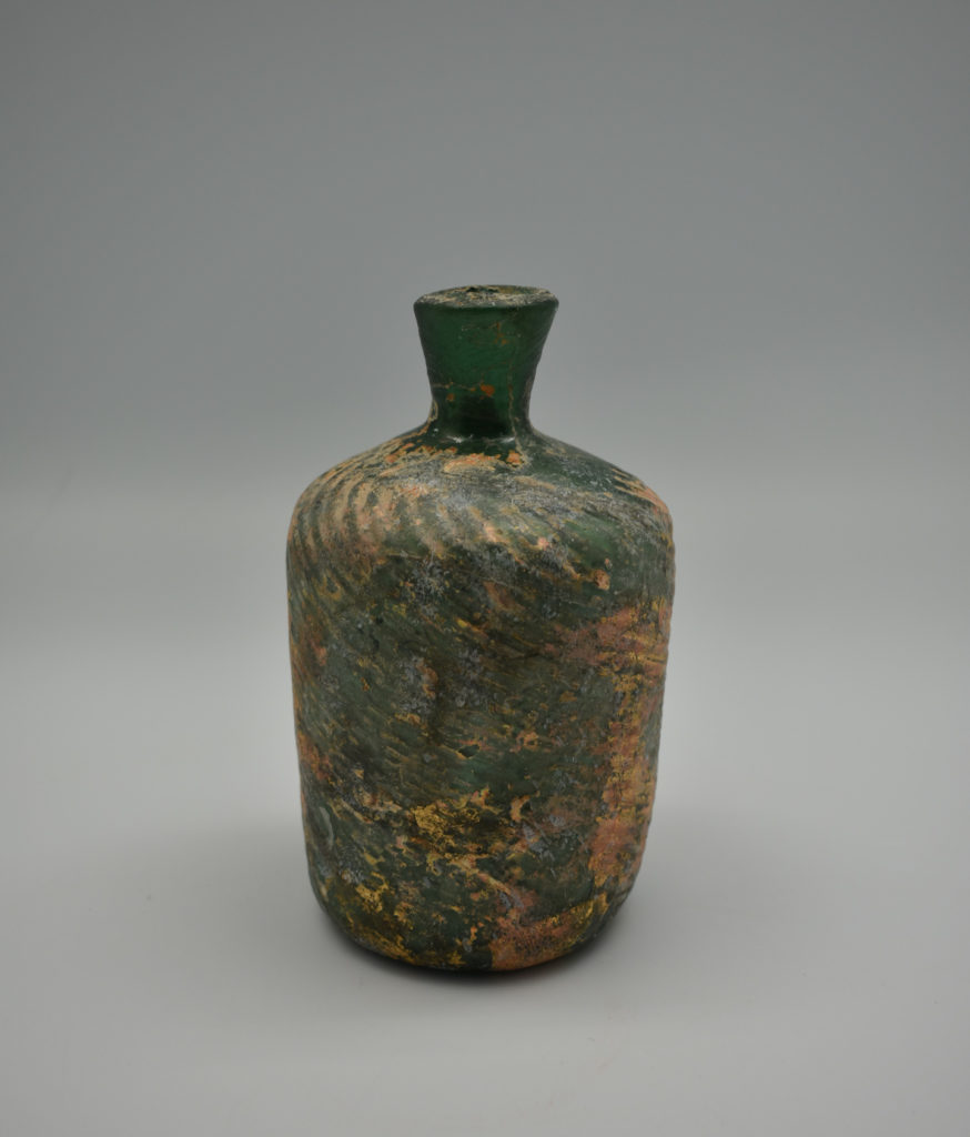 A weathered glass bottle from Palestine (Late Roman Period)