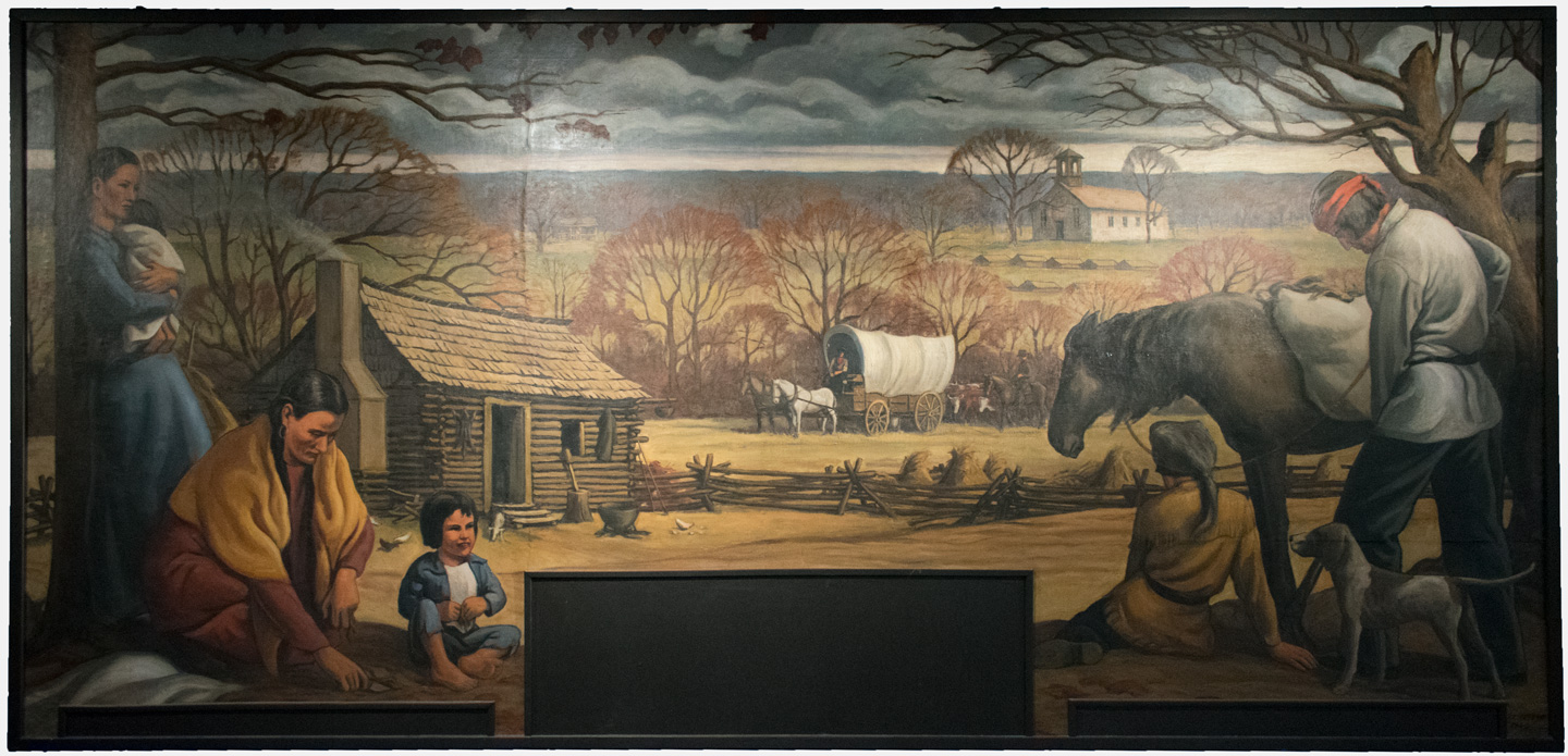 A large mural of a Choctaw homestead in McCurtain County by Louis Feund