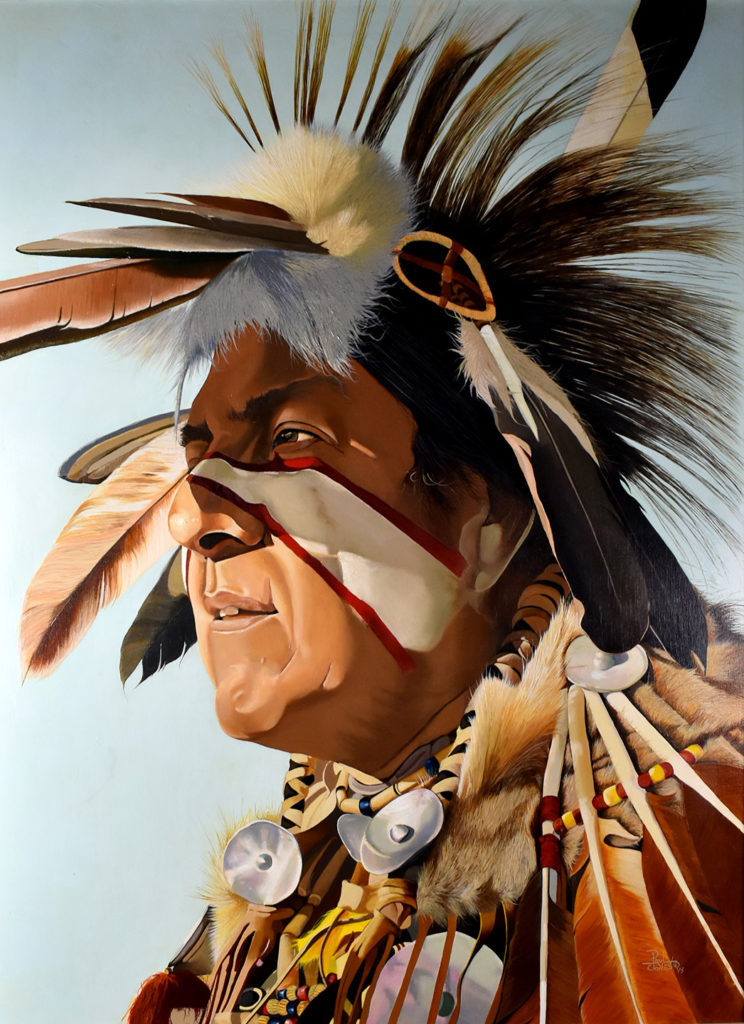 A portrait of a native man in traditional clothes with the sun in his eyes (by Paul Jones)